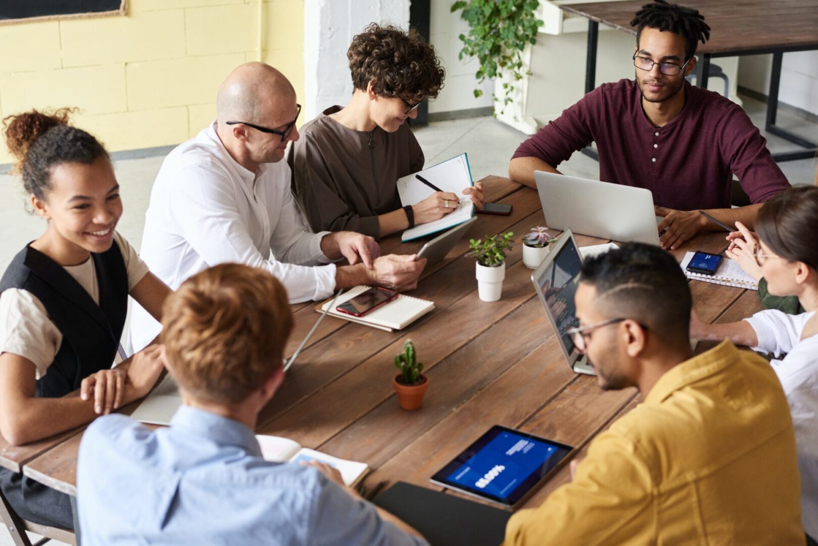 A group of people sitting around a table.